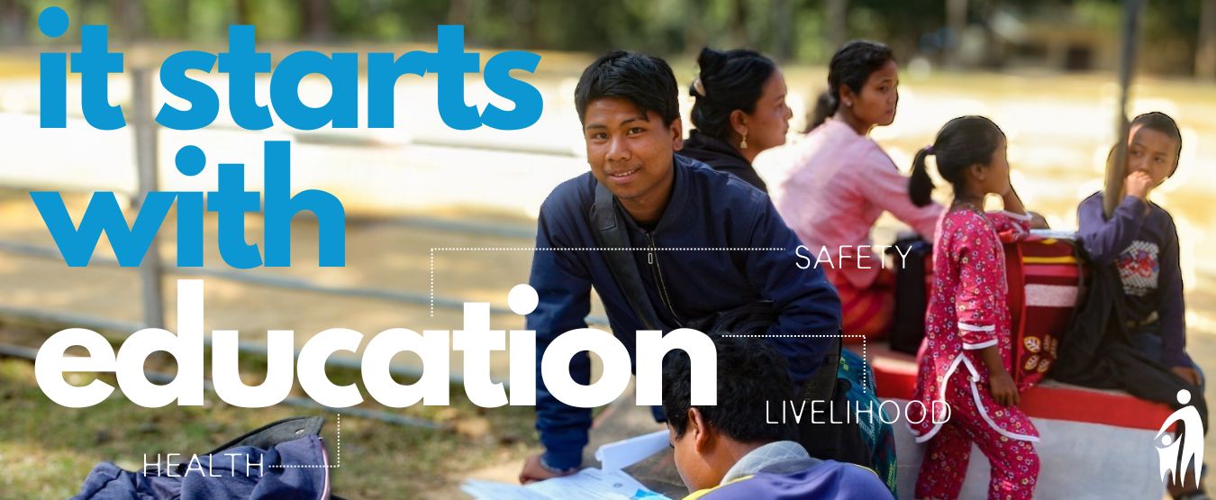 Image of Nepalese school kids- one boy is looking at the camera. Text in the image reads "It Starts With Education"